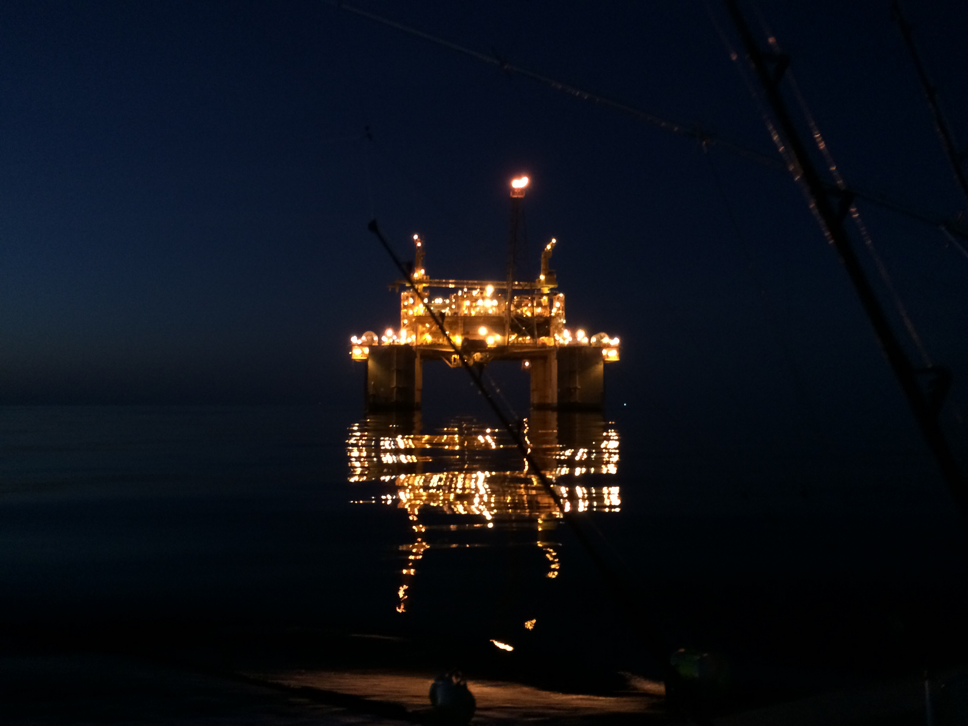 About Us 1 Oil rig at night lay up at our anchorage area